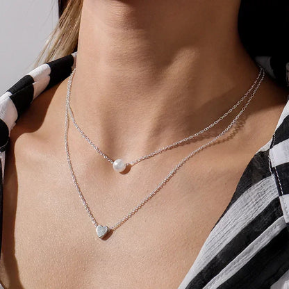 Nouveau collier perle pour femme 2025 – Style K-pop, couleur dorée, avec pendentif perlé, chaîne double couche type choker. Bijou de mode tendance gothique.