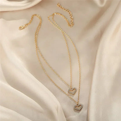 Nouveau collier perle pour femme 2025 – Style K-pop, couleur dorée, avec pendentif perlé, chaîne double couche type choker. Bijou de mode tendance gothique.