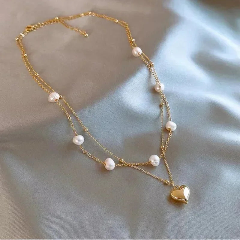 Nouveau collier perle pour femme 2025 – Style K-pop, couleur dorée, avec pendentif perlé, chaîne double couche type choker. Bijou de mode tendance gothique.