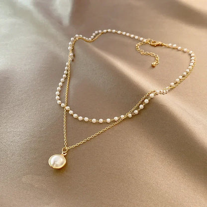 Nouveau collier perle pour femme 2025 – Style K-pop, couleur dorée, avec pendentif perlé, chaîne double couche type choker. Bijou de mode tendance gothique.